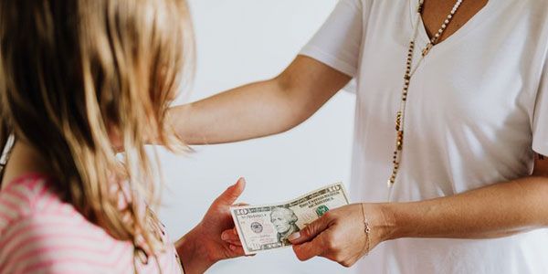 How should a parent decide how much money to give their child for an allowance?